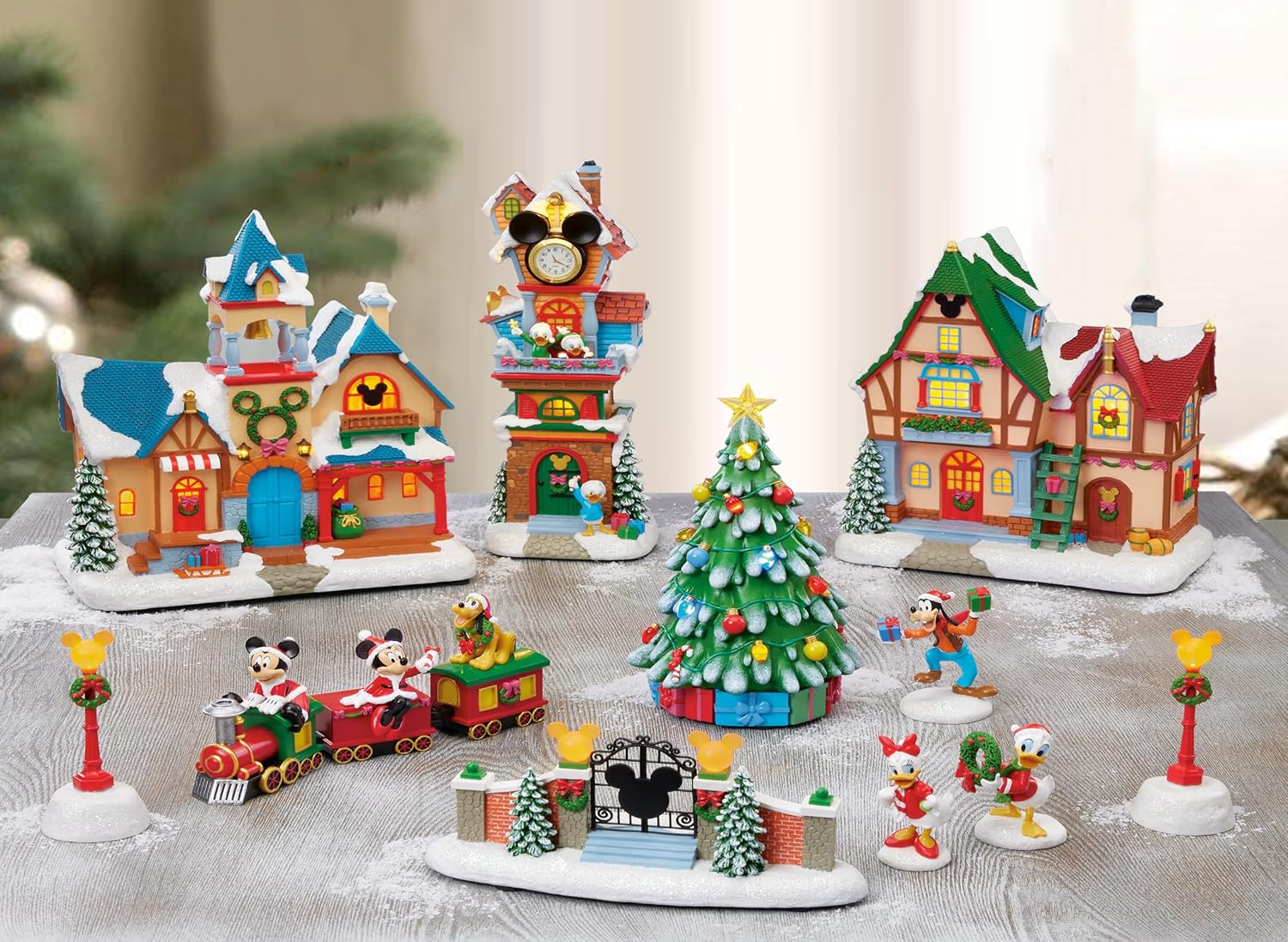 Disney Christmas Village Collection 13 Pieces with LED Lights, Music & Timer Hand Painted Buildings and Cartoon Characters Battery Operated Holiday Decoration