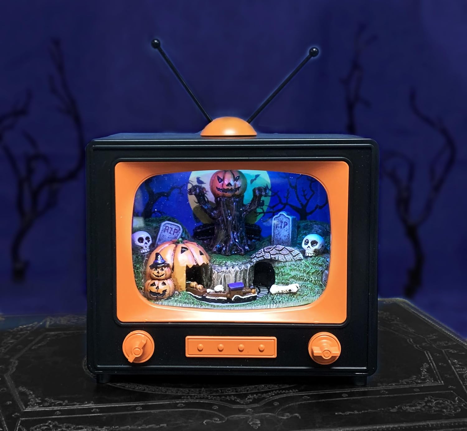 Animated Halloween TV Decoration with LED Lighted Graveyard Scene and Moving Train, Musical Pumpkin Display Battery Operated Spooky Tabletop Decor for Home Office Party